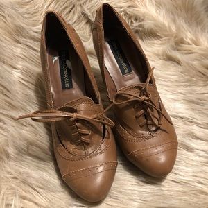 Distressed laced oxford pumps